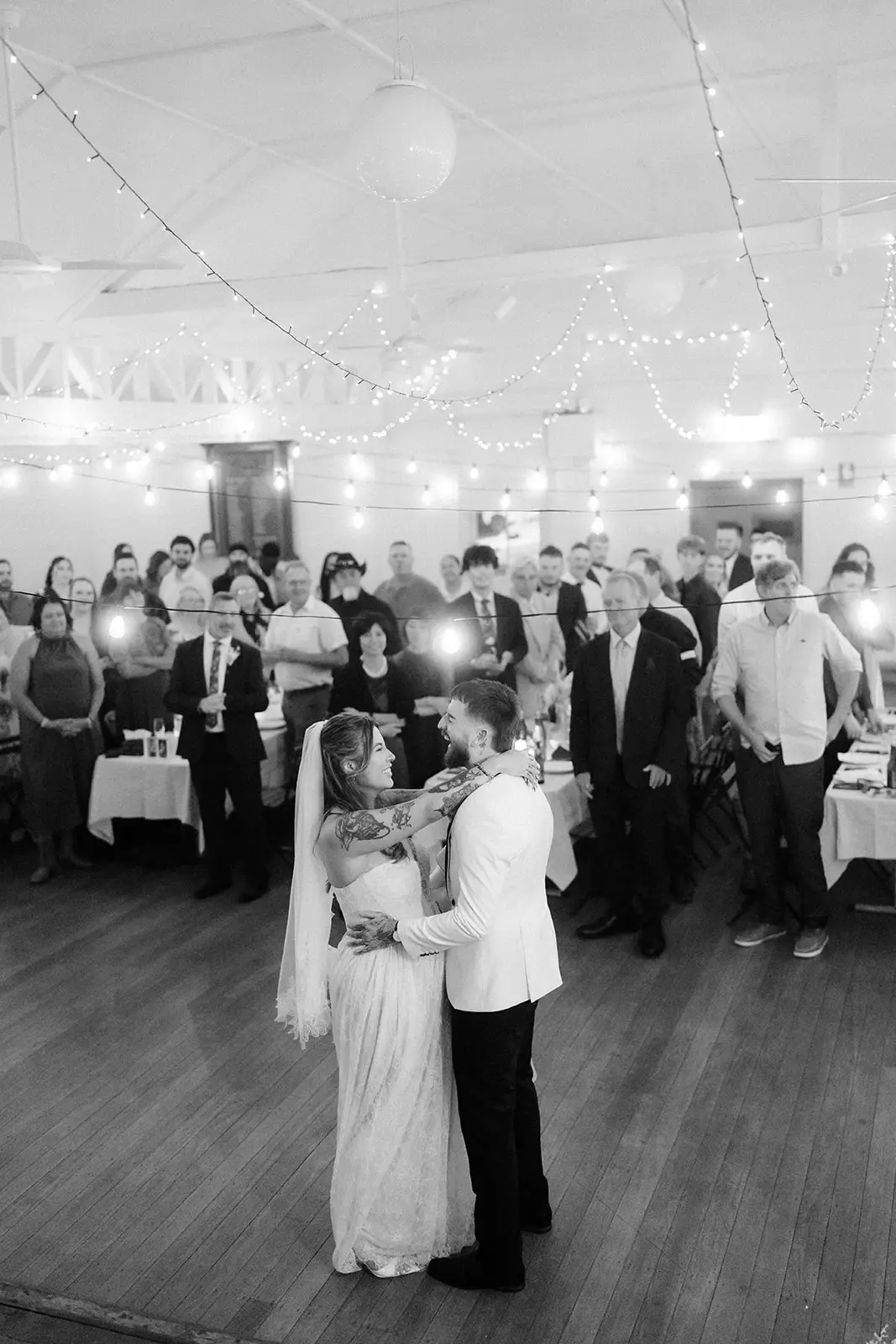 Black and white — the first dance on the timber floor as guests watch, Ewingsdale Hall