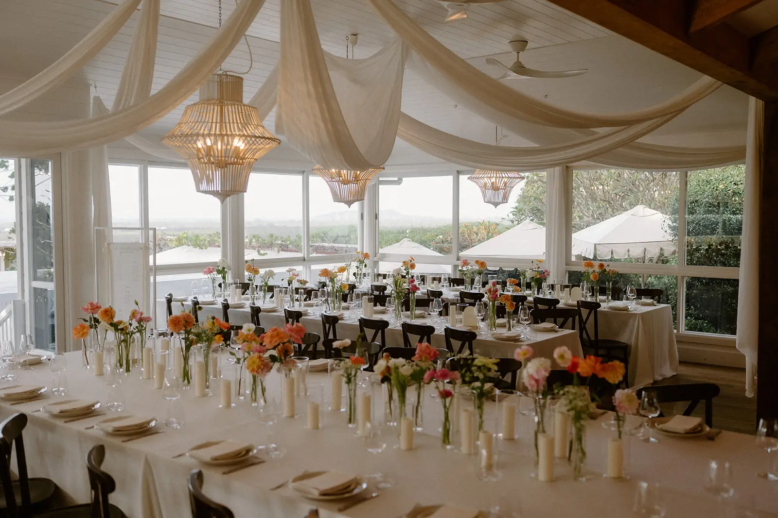 Long tables set for dinner beneath the draped ceiling and beaded chandeliers, Fig Tree Restaurant, Ewingsdale