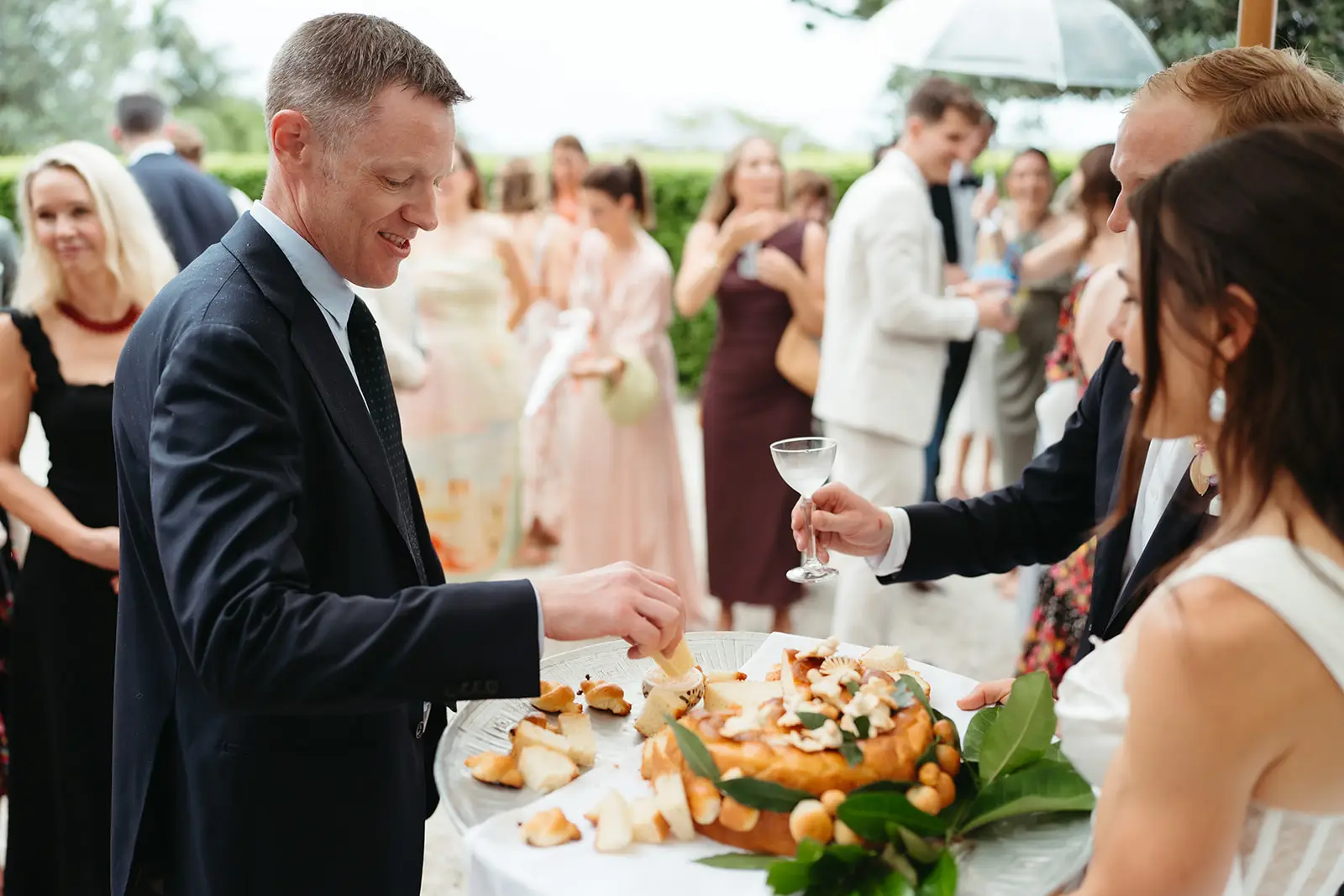 A guest taking a canapé from the platter during drinks, Fig Tree Restaurant