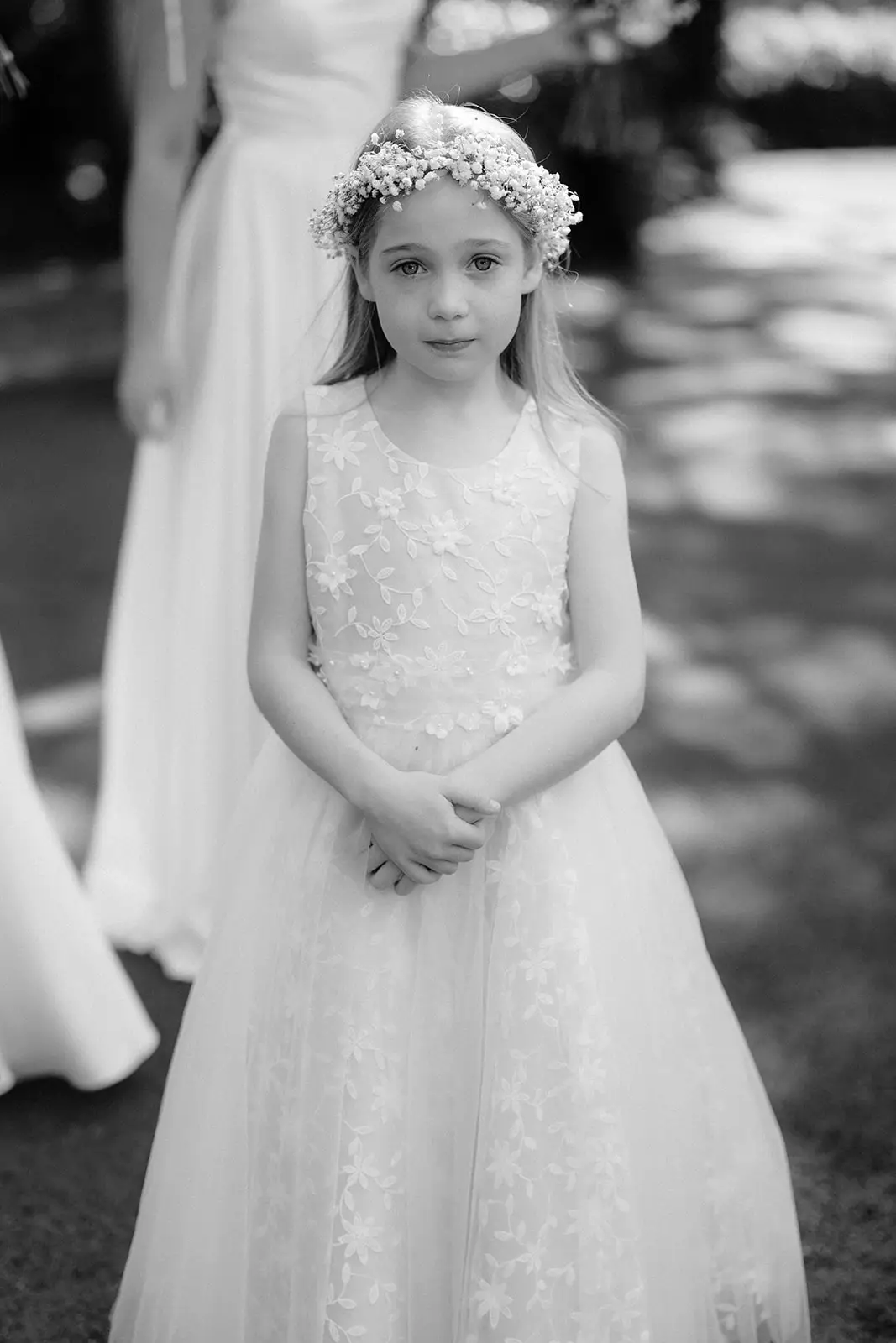 A flower girl in a white dress before the ceremony, Byron Bay
