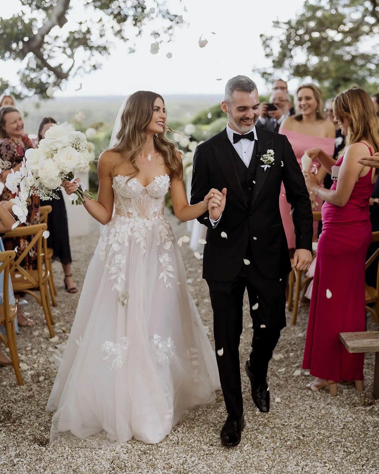 The gravel aisle running back through the seated guests with the hinterland beyond, Fig Tree Restaurant