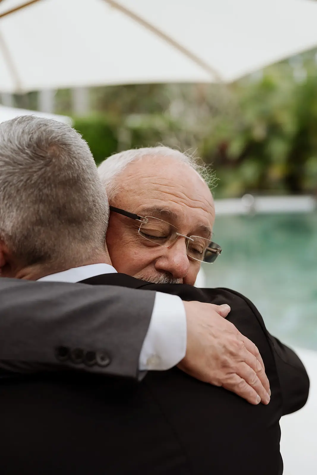 Two guests embracing beside the pool, Fig Tree Restaurant, Byron Bay