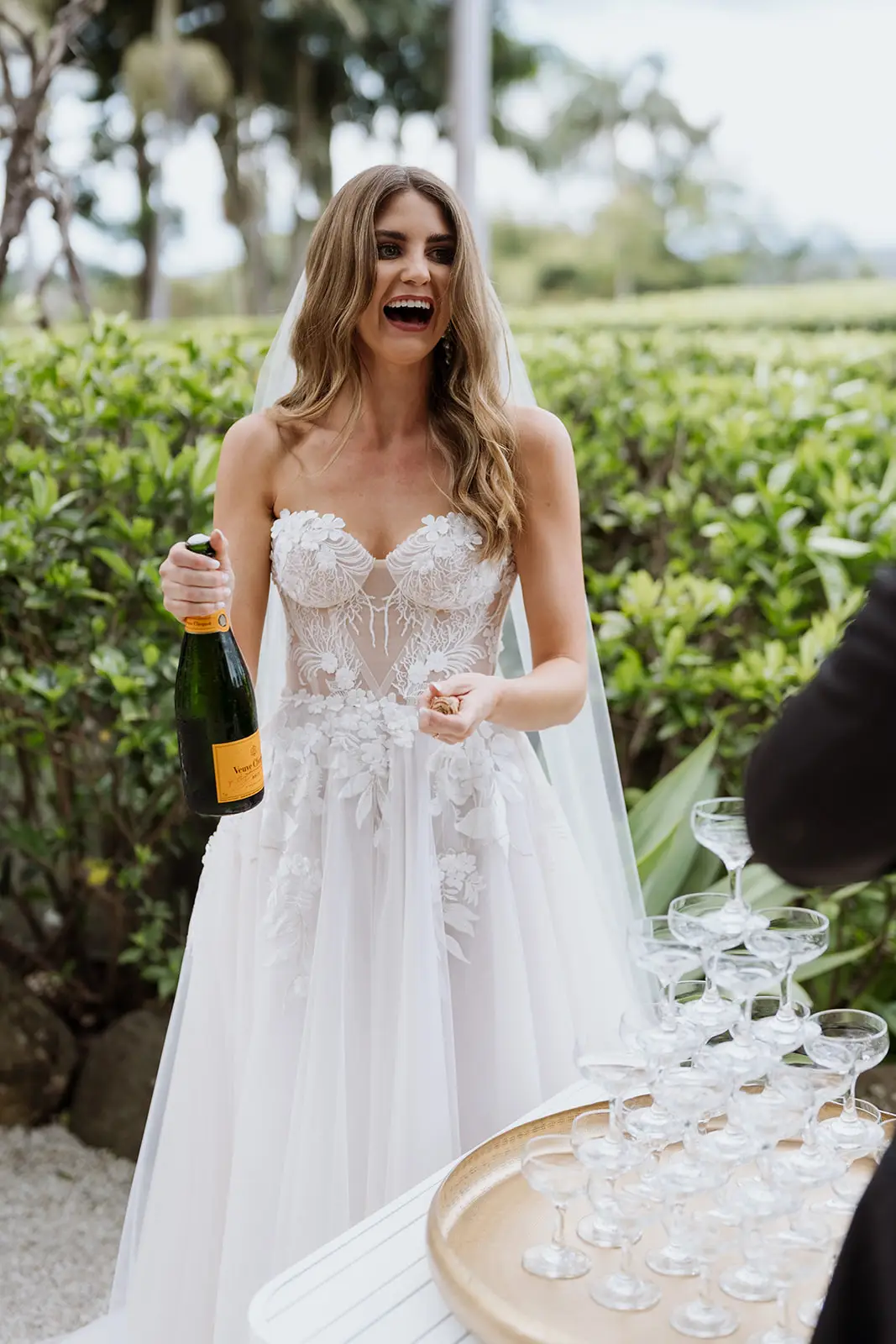 Letitia beside the champagne tower after the ceremony, Fig Tree Restaurant