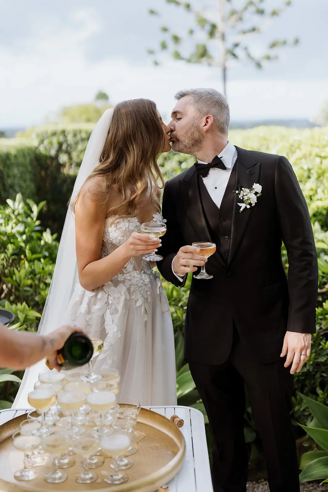 Letitia and Yoni toasting beside the champagne tower, Byron Bay