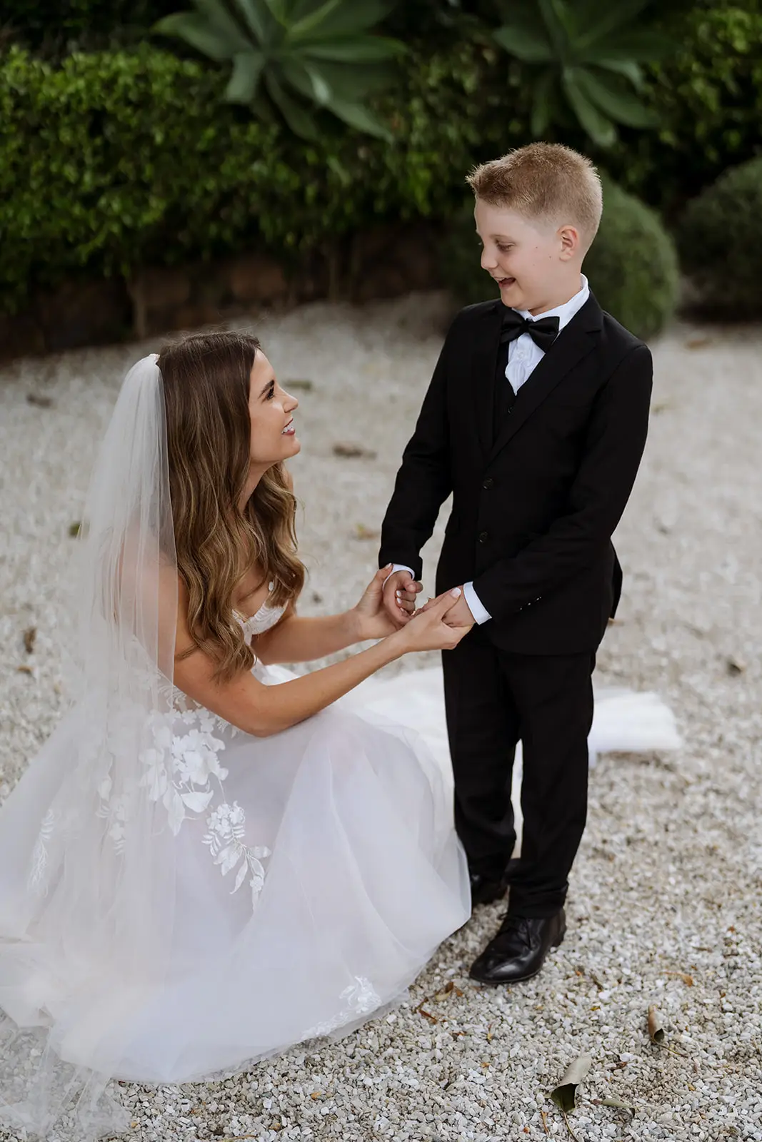 A flower girl and page boy holding hands, Fig Tree Restaurant