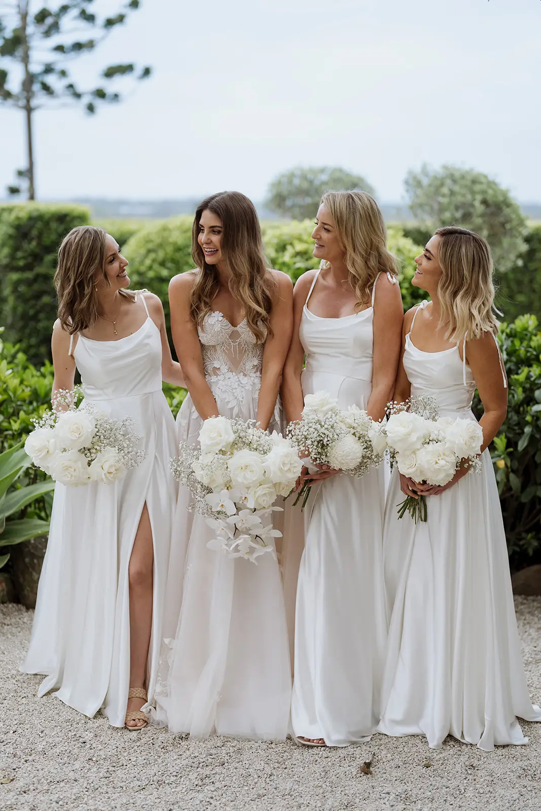 The bridesmaids in champagne dresses with white bouquets, Byron Bay