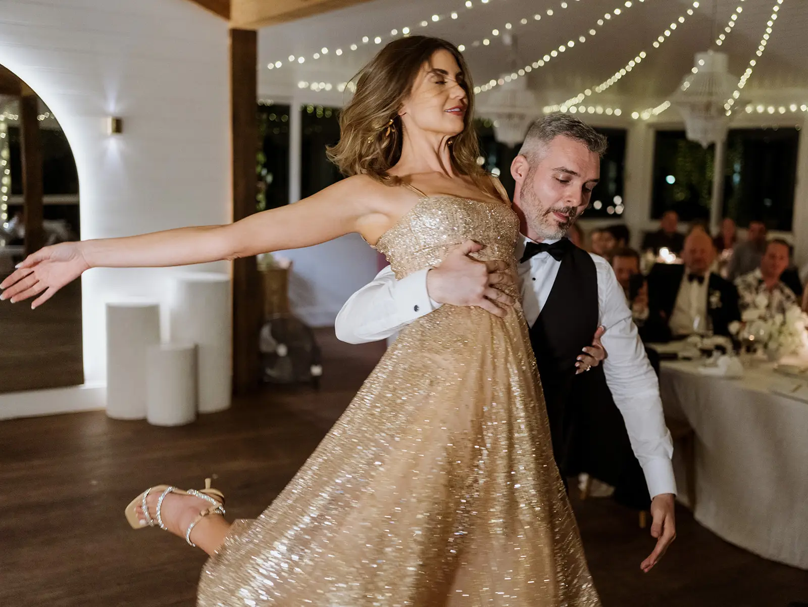 Guests dancing under festoon lights, Fig Tree Restaurant, Byron Bay