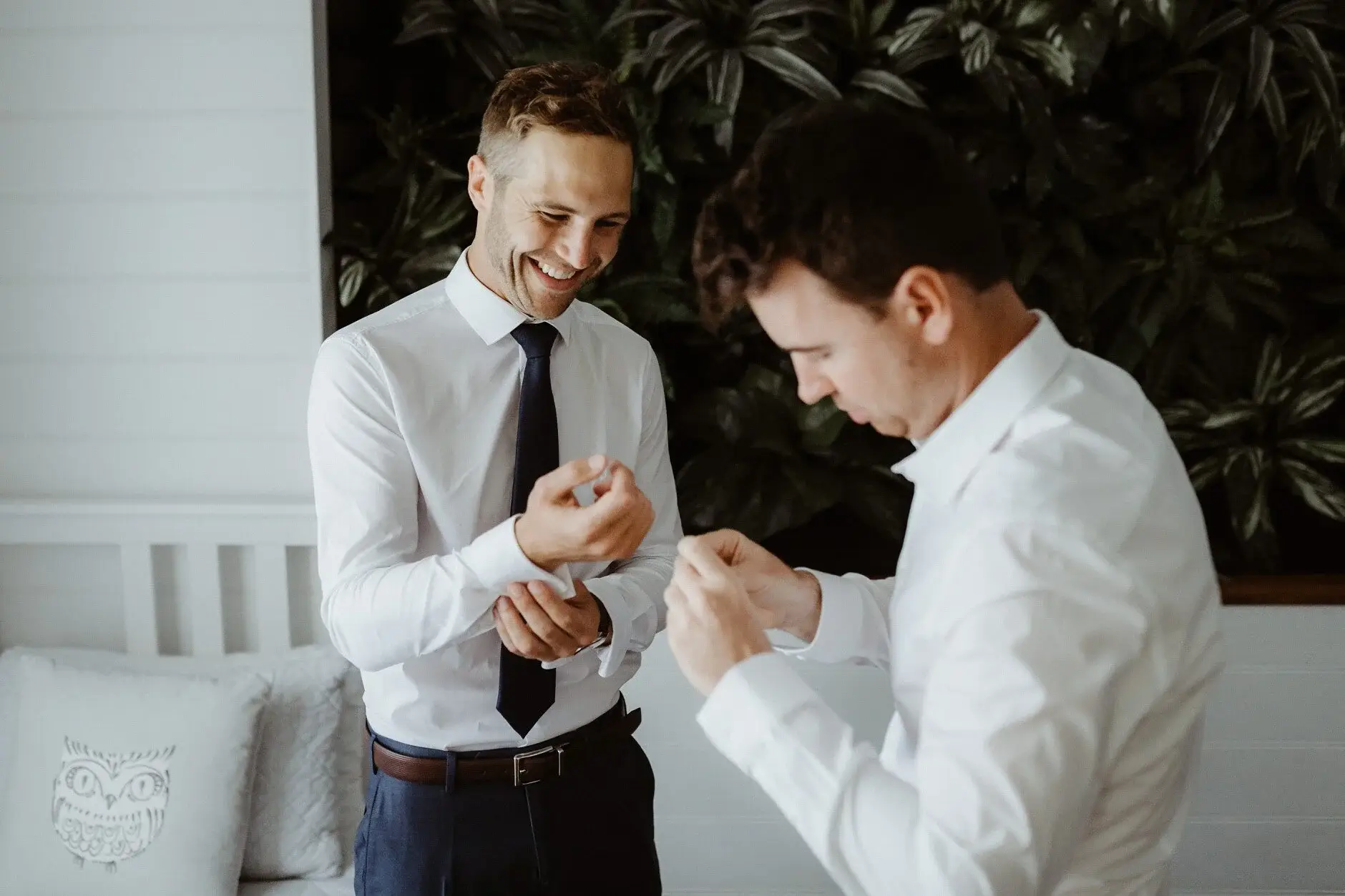 A groomsman helping Nev with his cufflinks, Byron Bay