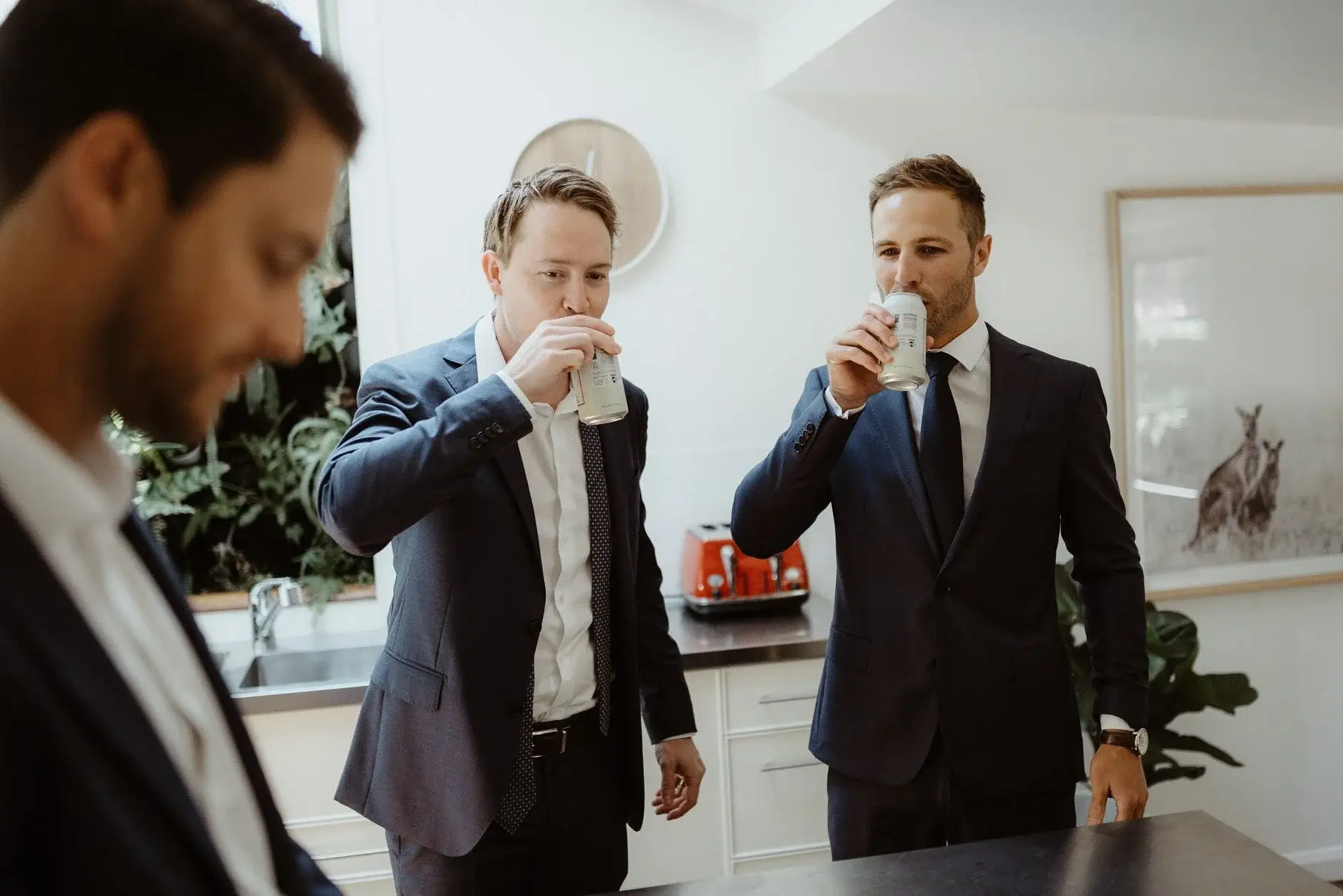 The groomsmen having a drink together before the wedding, Byron Bay