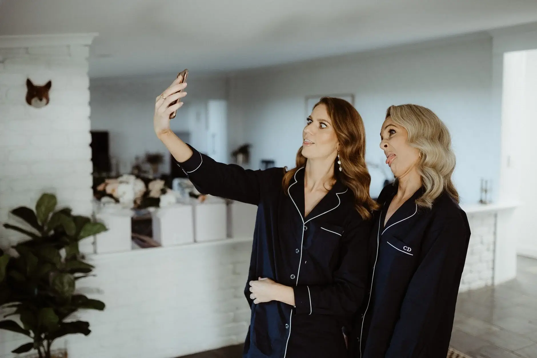 Em and a bridesmaid taking a selfie in matching pyjamas, Byron Bay