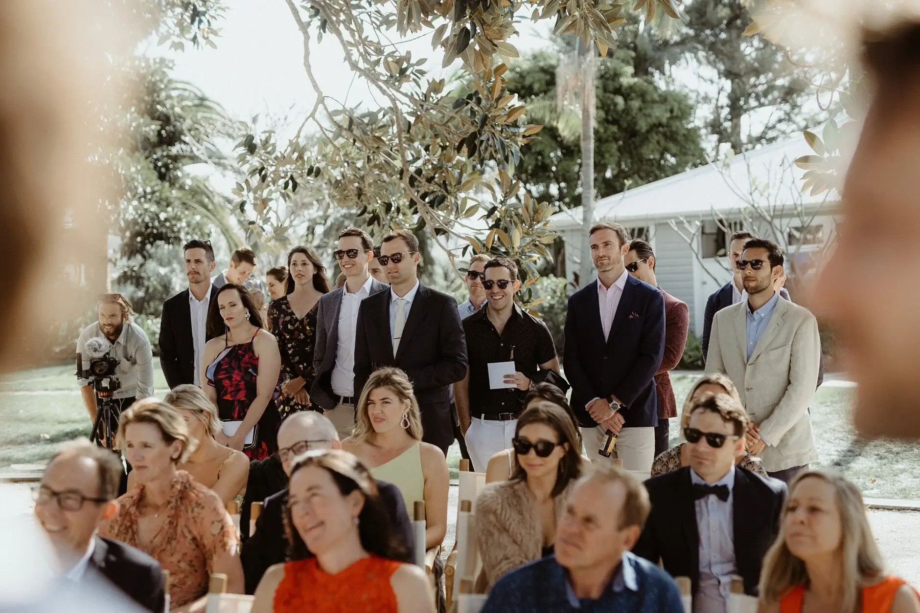 Guests watching the ceremony in the sunshine, Fig Tree Restaurant