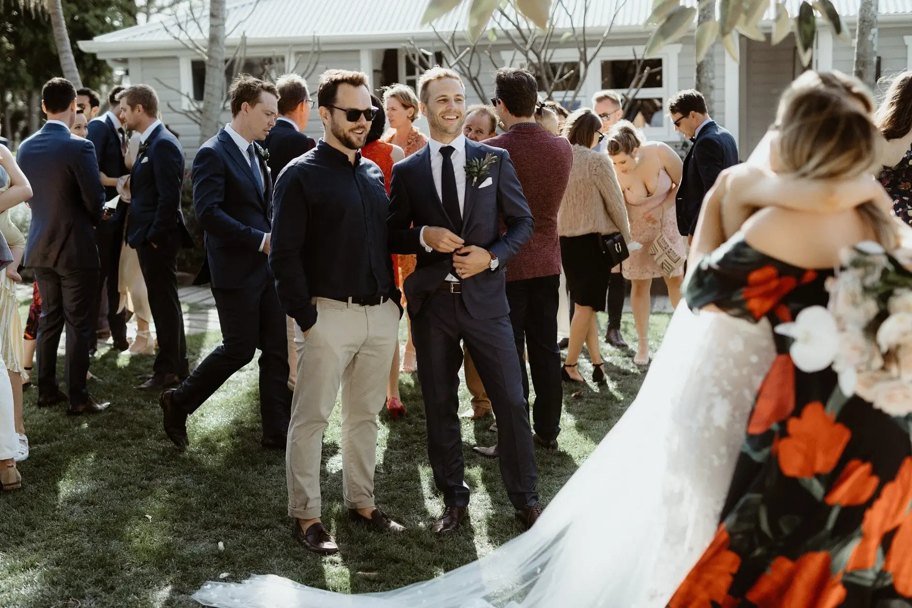 Guests mingling on the lawn after the ceremony, Fig Tree Restaurant