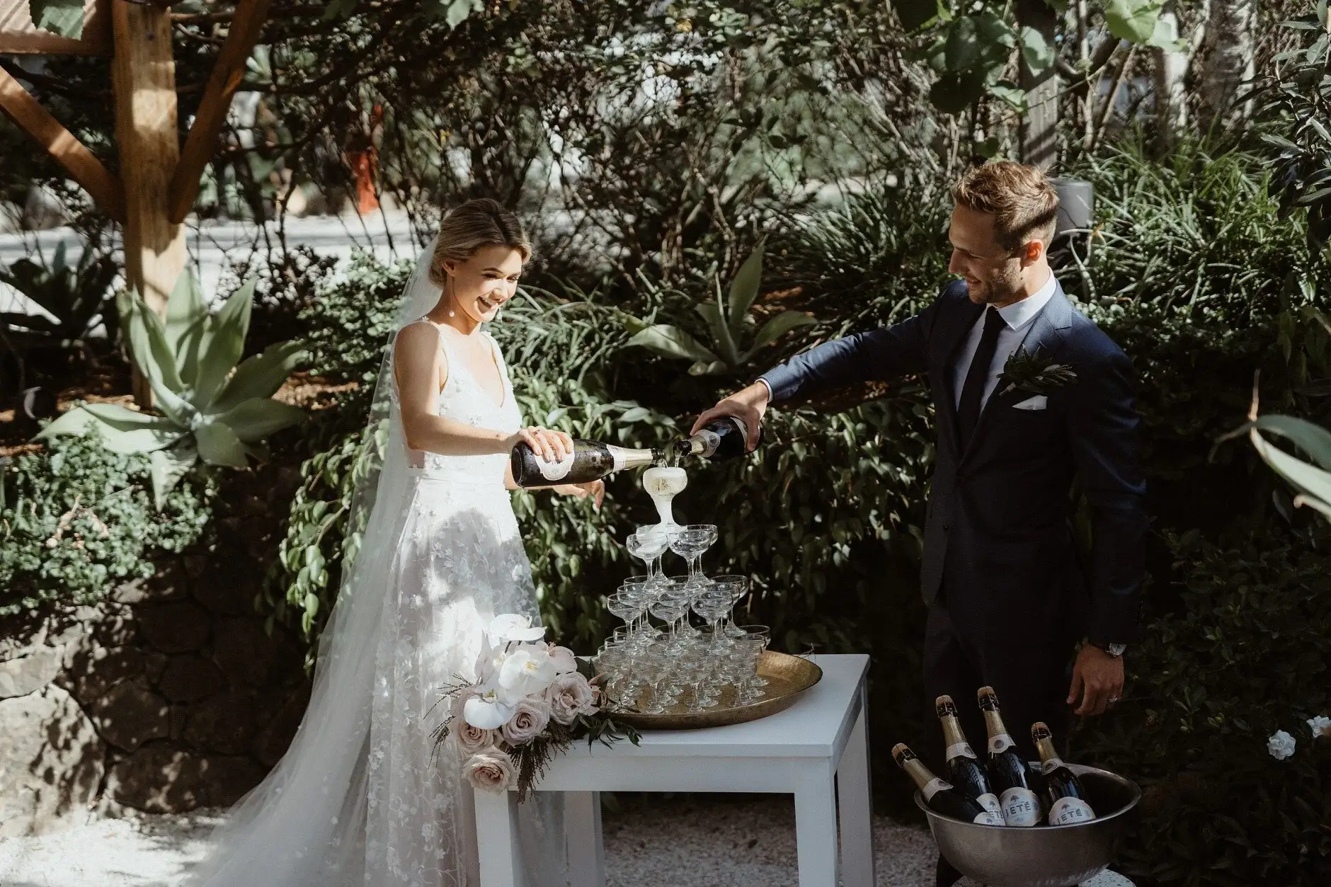 Em and Nev building the champagne tower together, Byron Bay