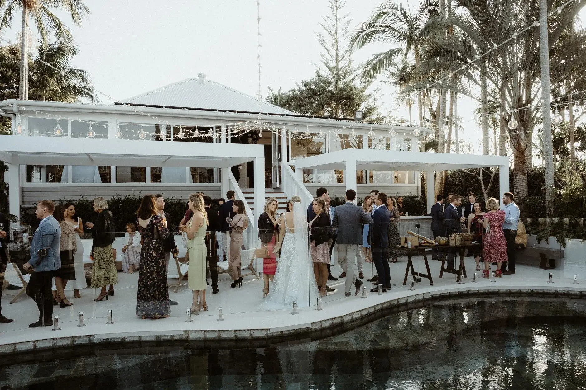 Guests gathered by the pond at the Fig Tree Restaurant, Byron Bay