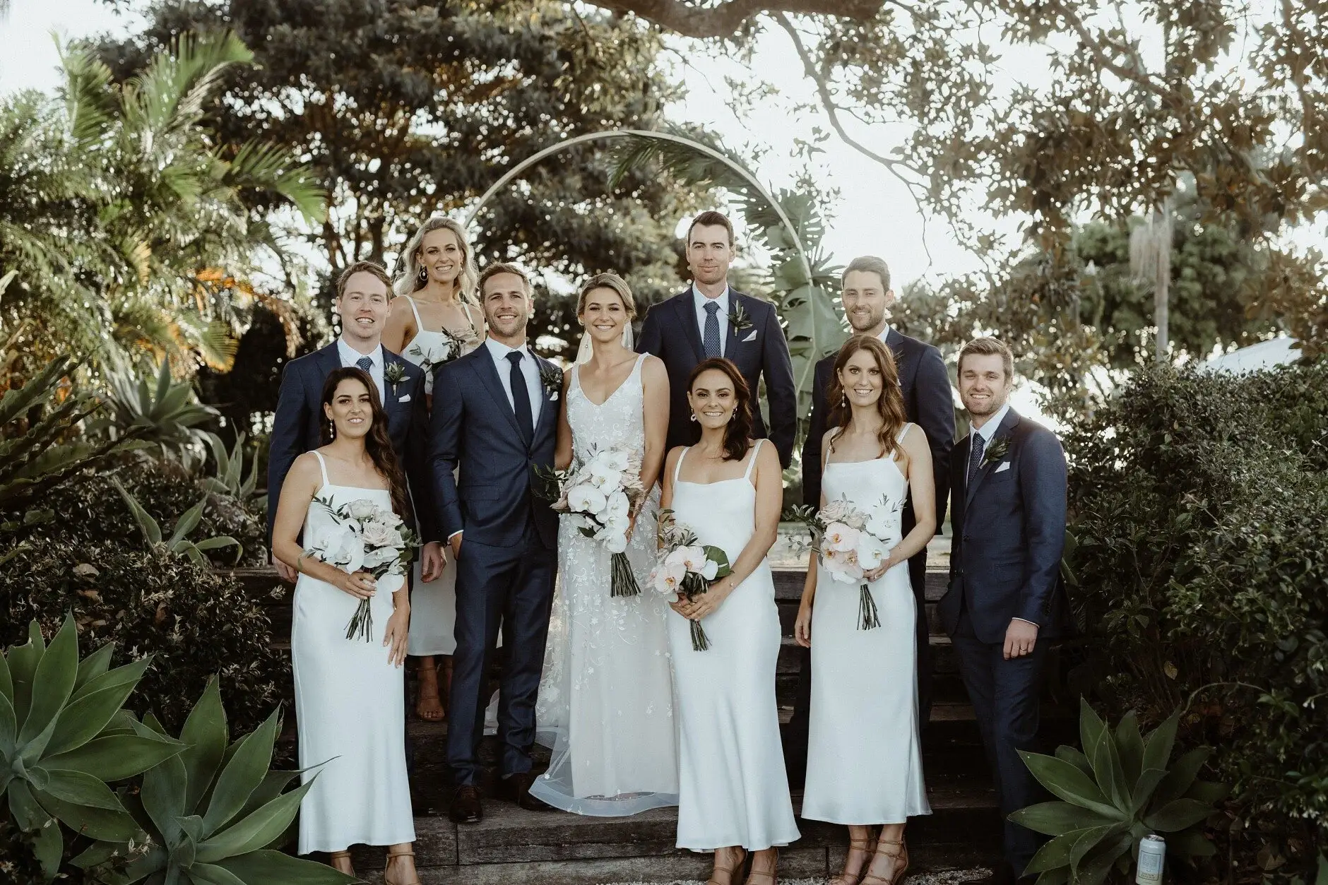 The full bridal party in the garden at the Fig Tree, Byron Bay