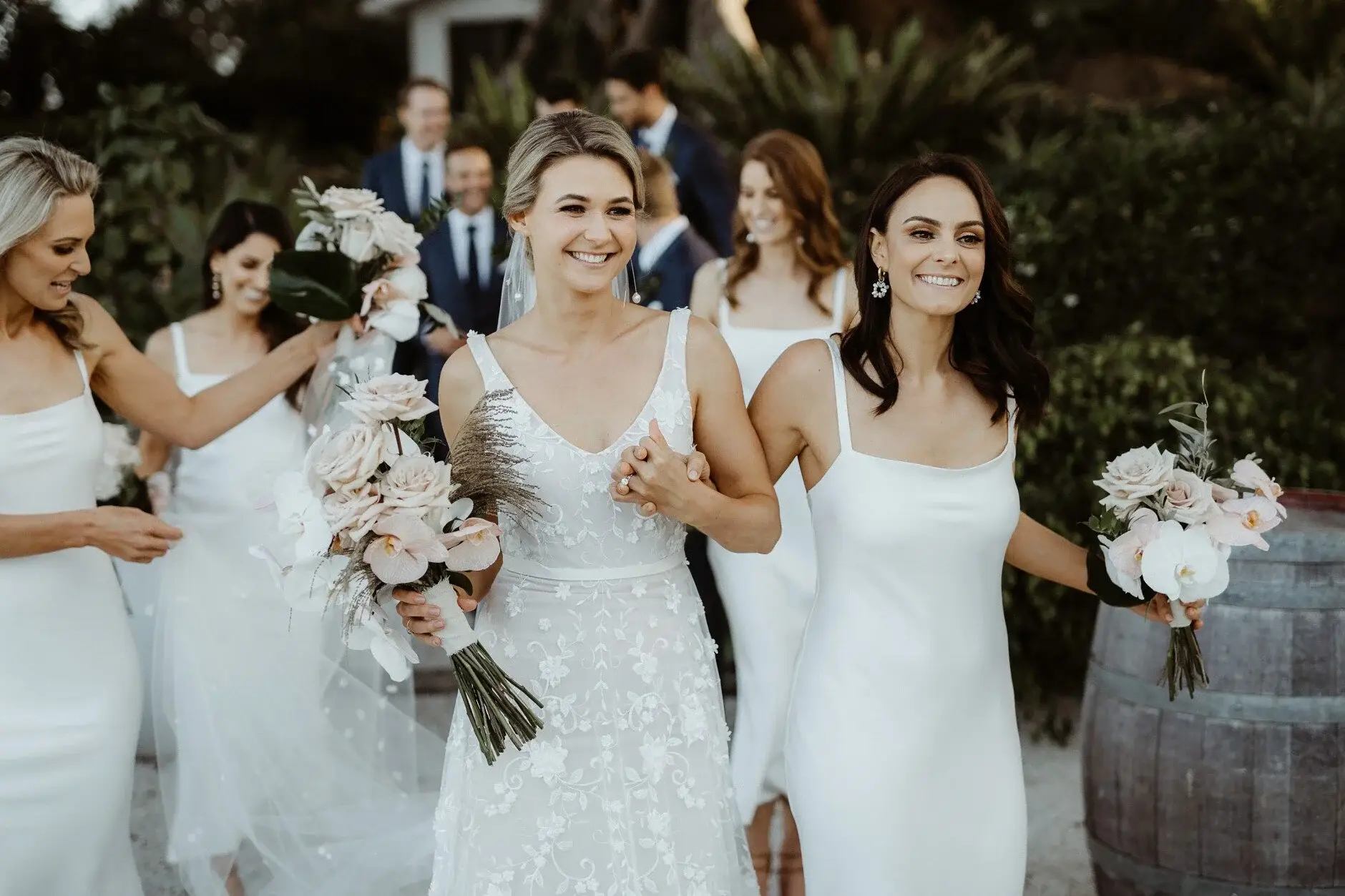 The bridesmaids around Em with their bouquets, Byron Bay