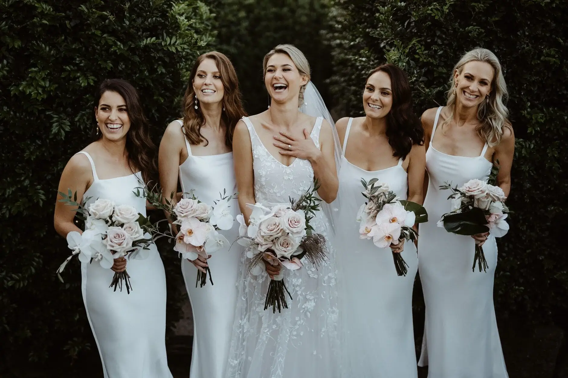 Em and her bridesmaids lined up in the garden, Byron Bay
