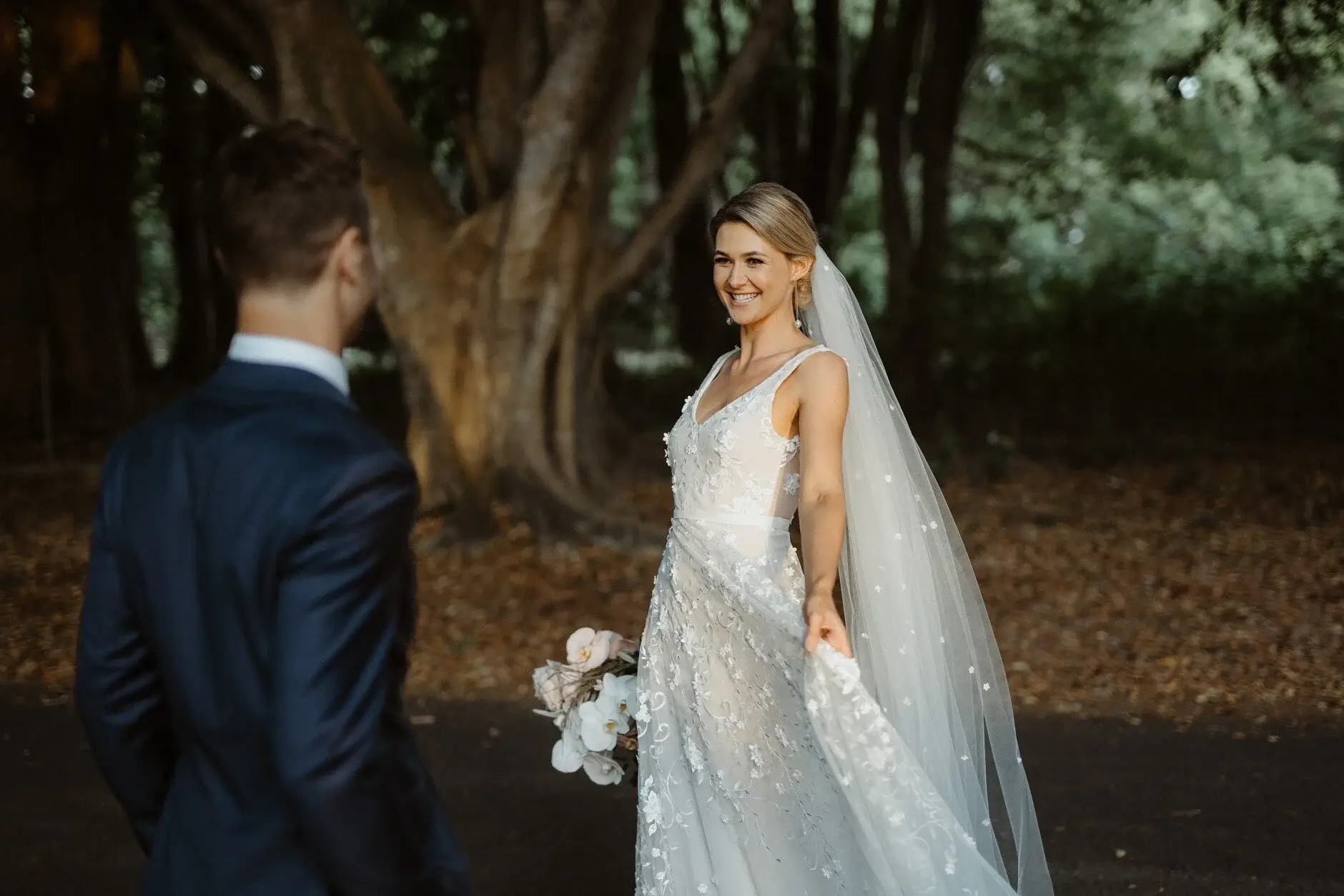 Em and Nev walking beneath the fig trees, Byron Bay