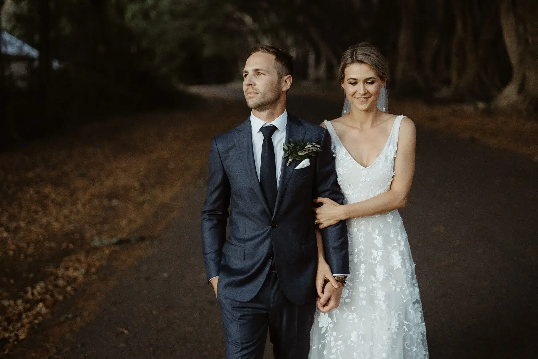 Em and Nev standing together on the road, Byron Bay