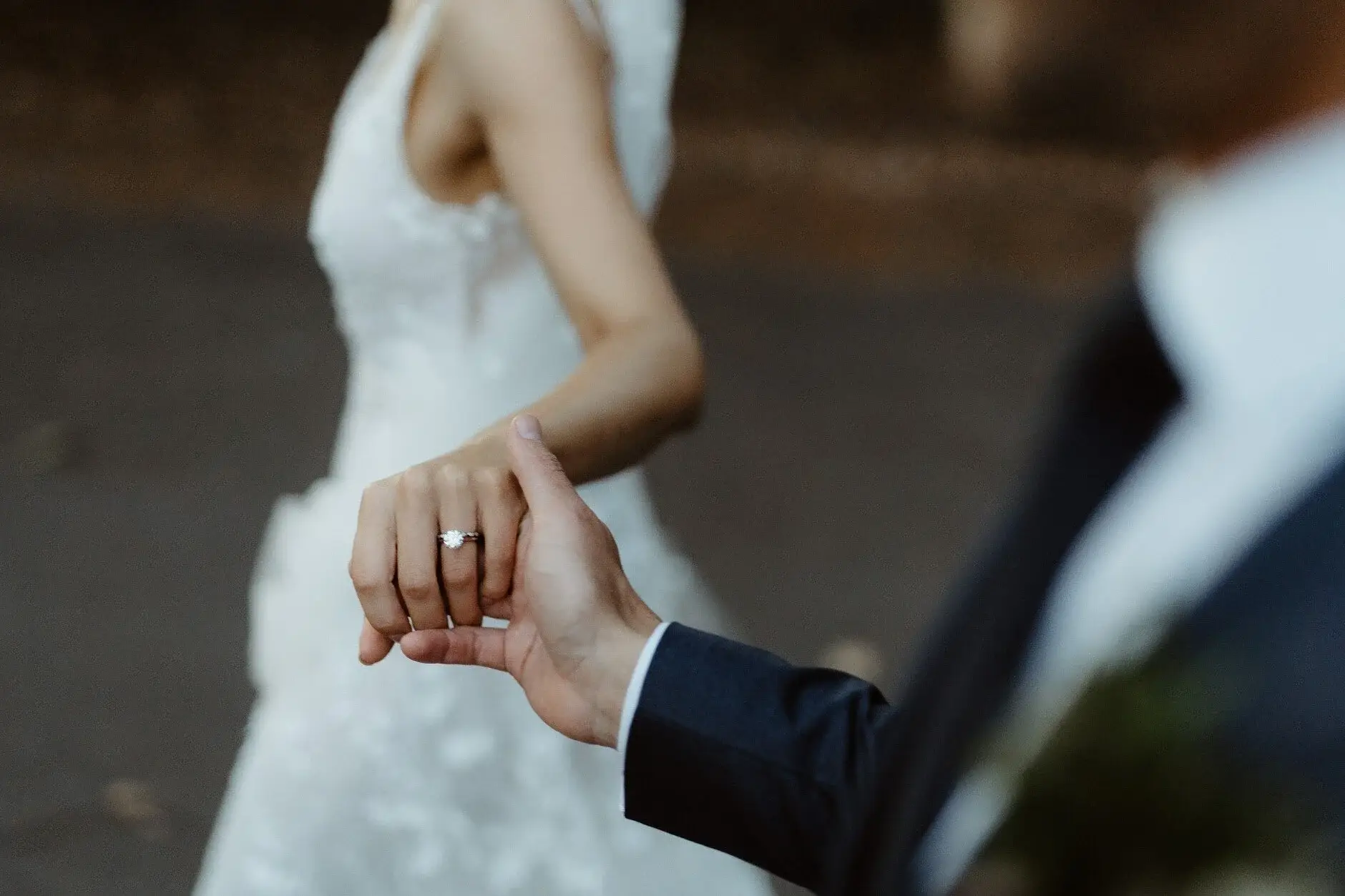 Nev holding Em’s hand, her wedding ring just visible, Byron Bay