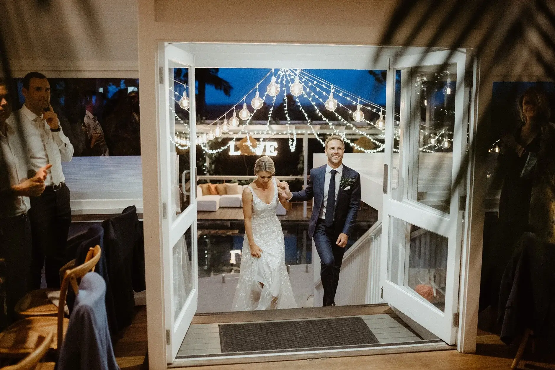 Em and Nev arriving at the reception through the doors, Byron Bay