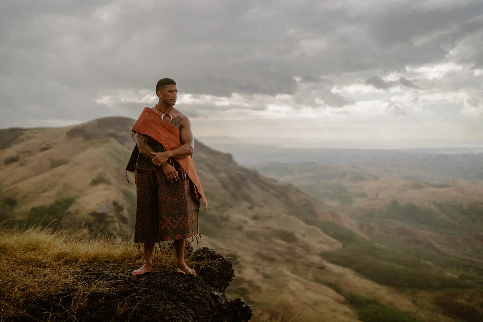 Viliame standing on a highland ridge in traditional masi, Nausori Highlands