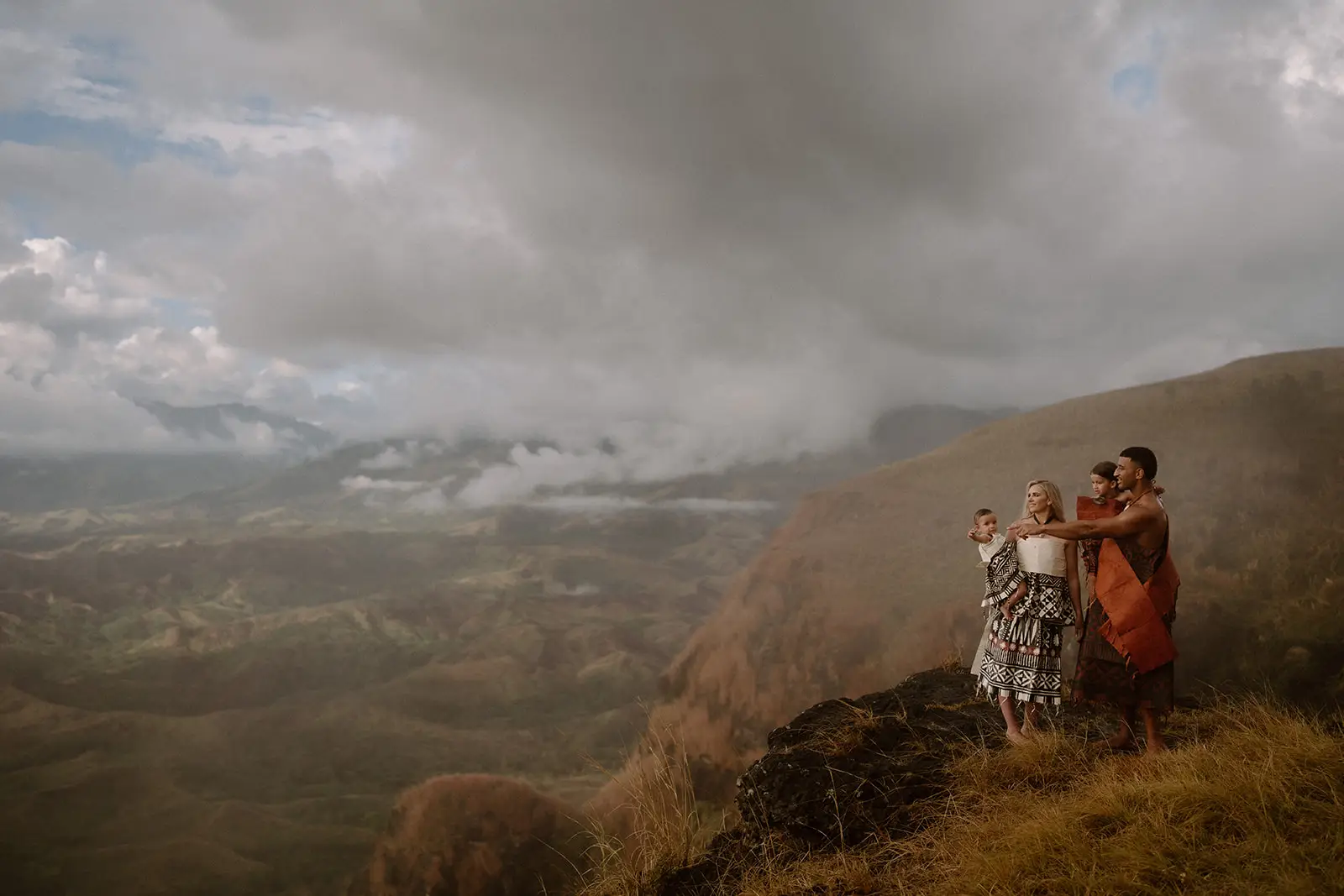 The couple and their entourage on a rocky outcrop in the Nausori Highlands