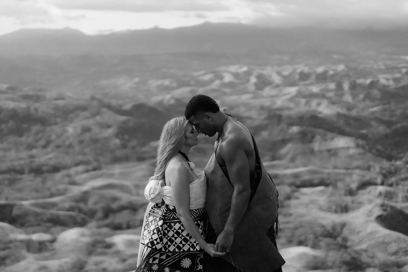 Brittany and Viliame embracing in highland mist, Fiji