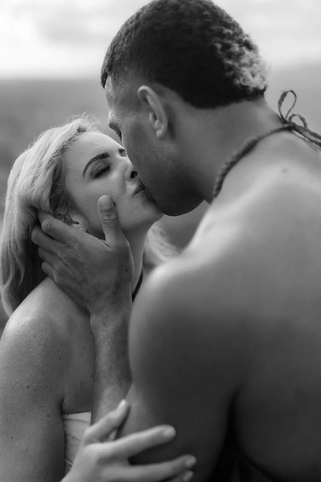 Brittany and Viliame kissing, close black and white portrait, Fiji