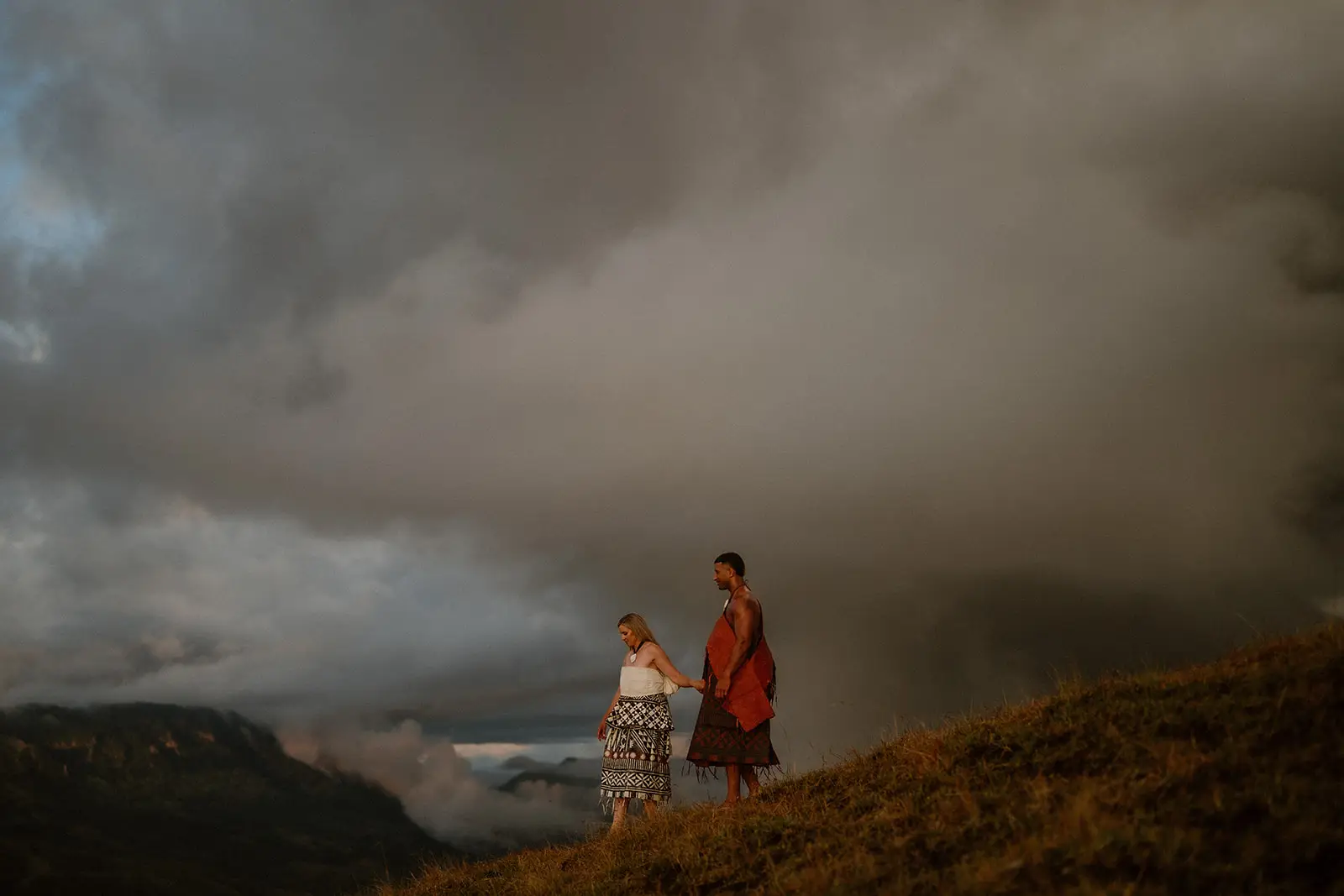 Viliame walking a stormy hillside in the Fijian highlands