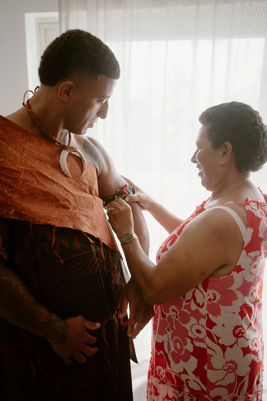 Viliame being helped into his masi before the wedding, Nadi Bay