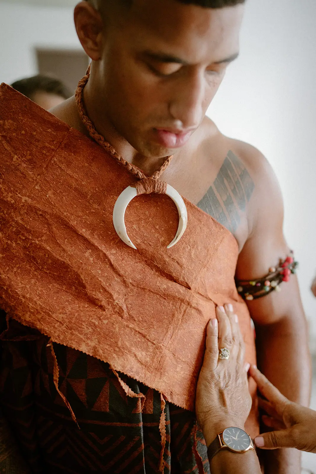 Viliame in masi with a carved pendant before the ceremony, Fiji