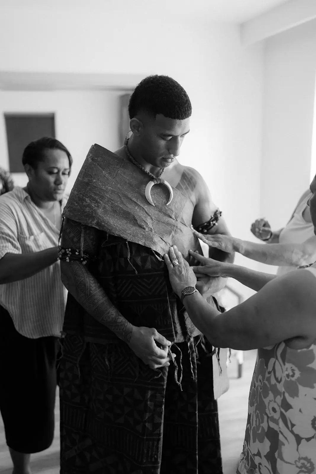 Family helping Viliame dress before the ceremony, Crowne Plaza Nadi Bay