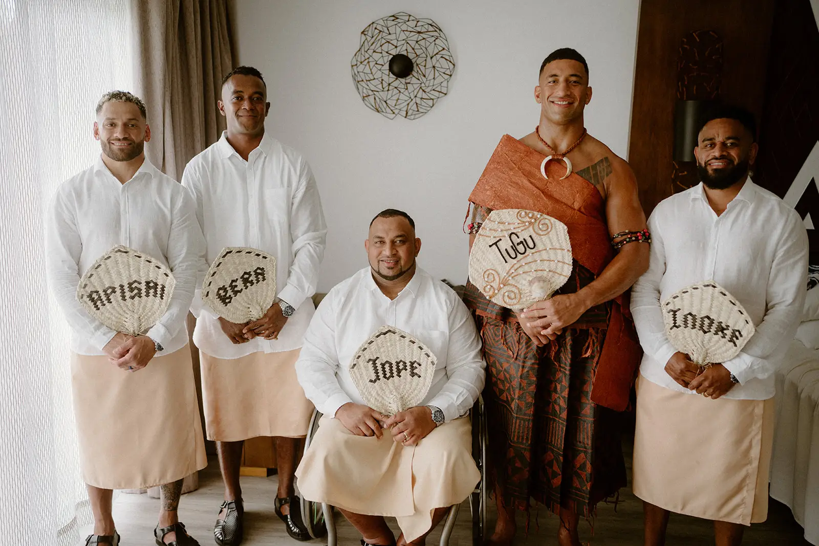 Viliame and his groomsmen with personalised woven fans, Nadi Bay