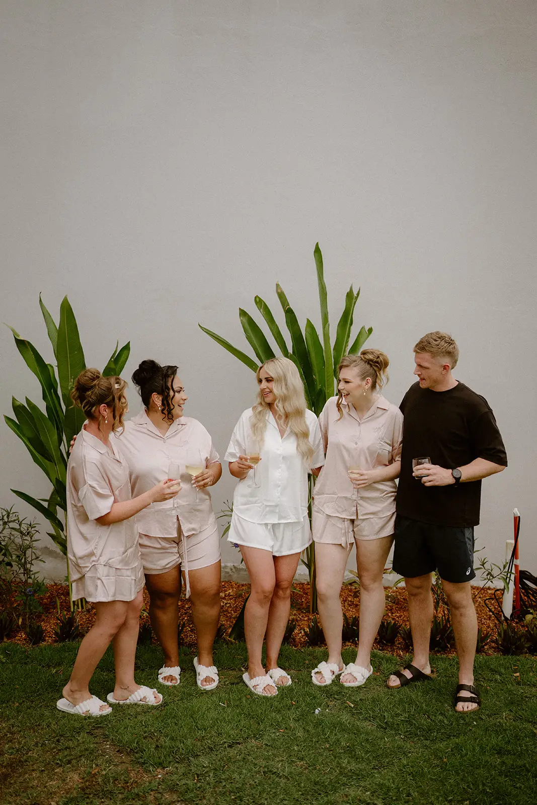 Bridesmaids in blush on the resort lawn, Crowne Plaza Nadi Bay
