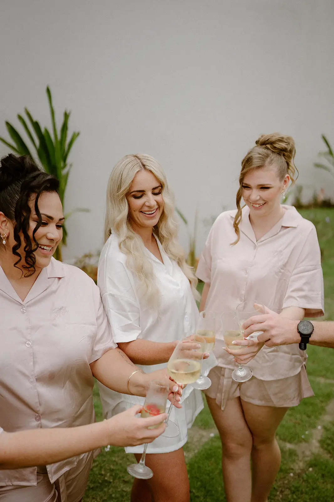 Bridesmaids laughing together before the ceremony, Nadi Bay