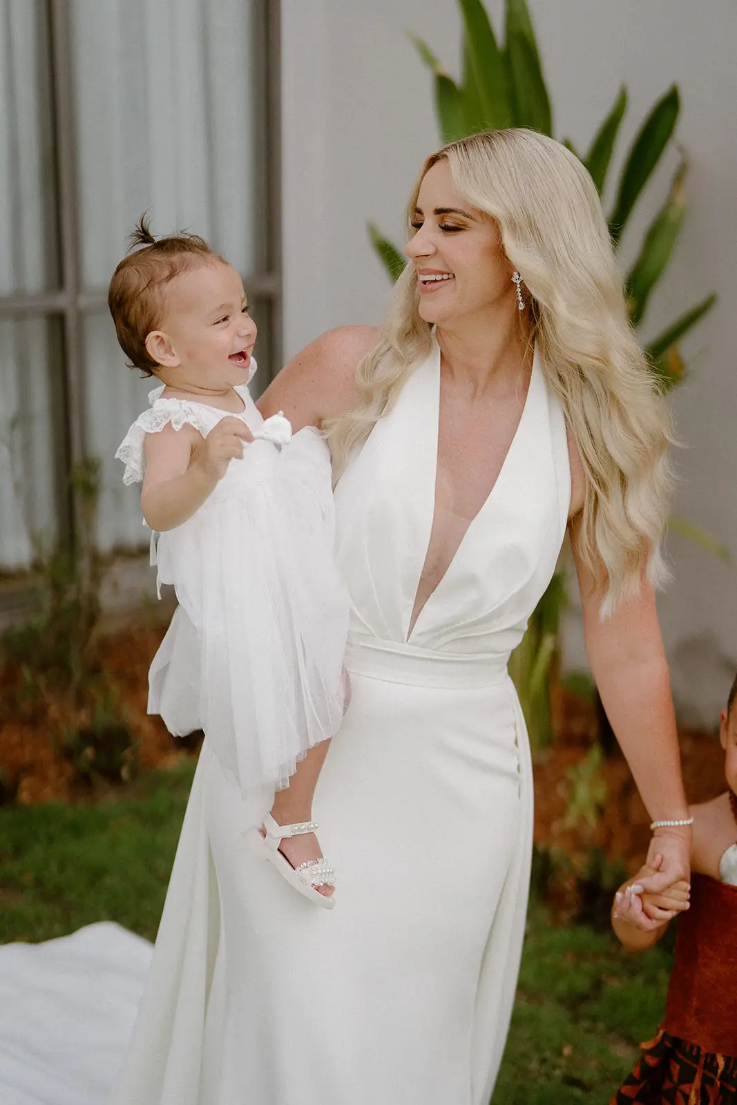 Brittany holding her daughter before the wedding, Nadi Bay
