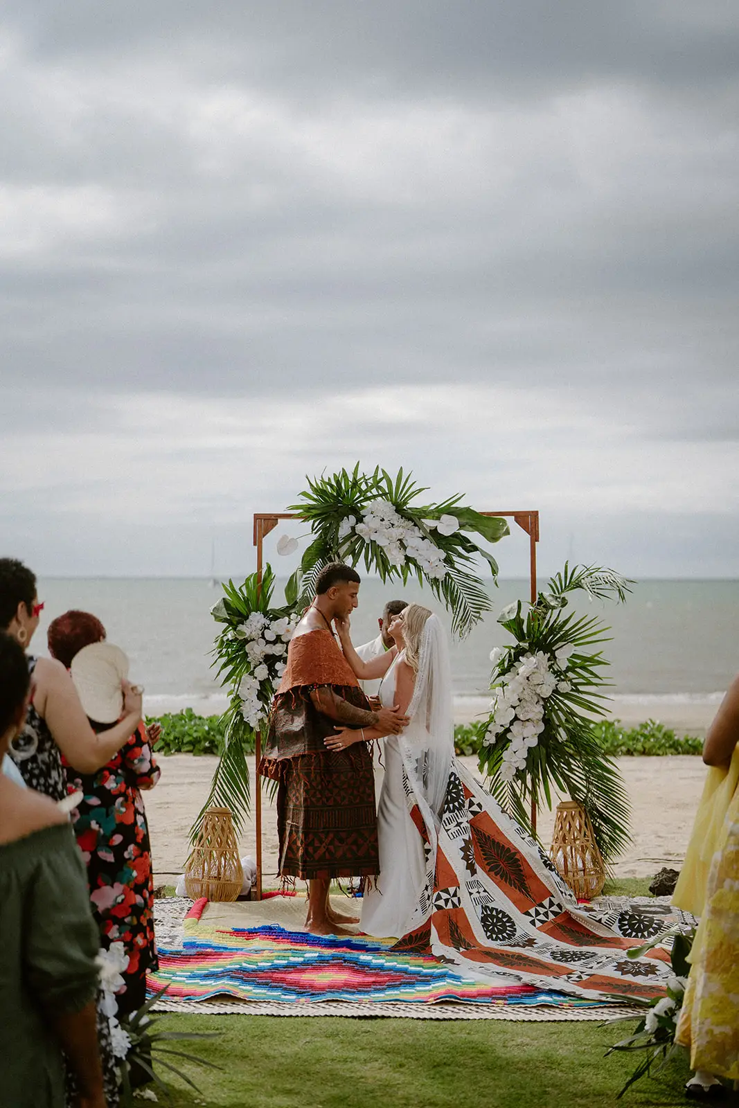 Brittany and Viliame at the altar, seen past the guests, Nadi Bay