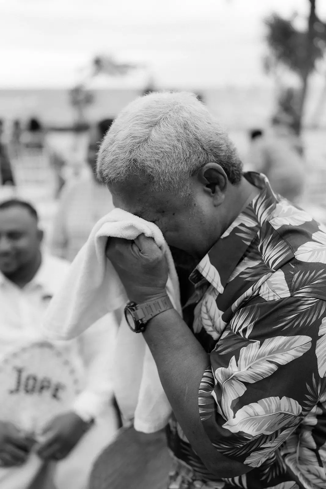 A guest wiping away tears after the ceremony, Nadi Bay