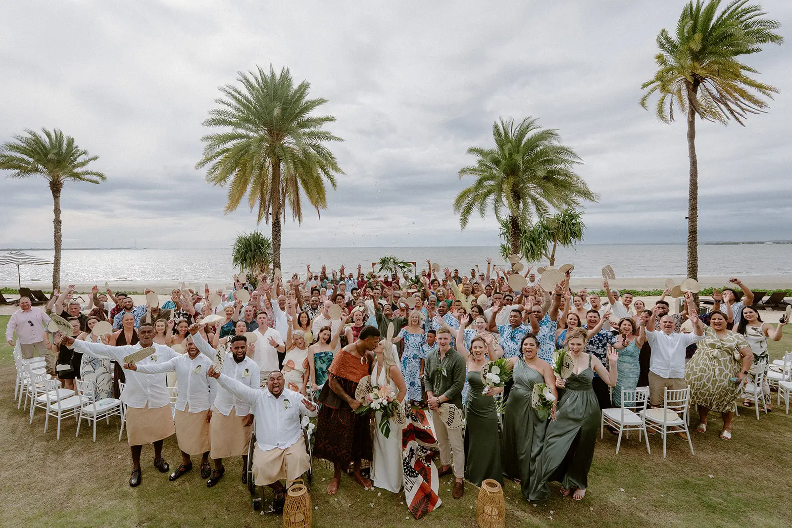 The full wedding party and guests on the lawn, Crowne Plaza Nadi Bay