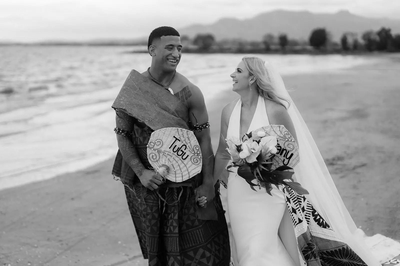 The newlyweds walking the beach at Nadi Bay, Fiji