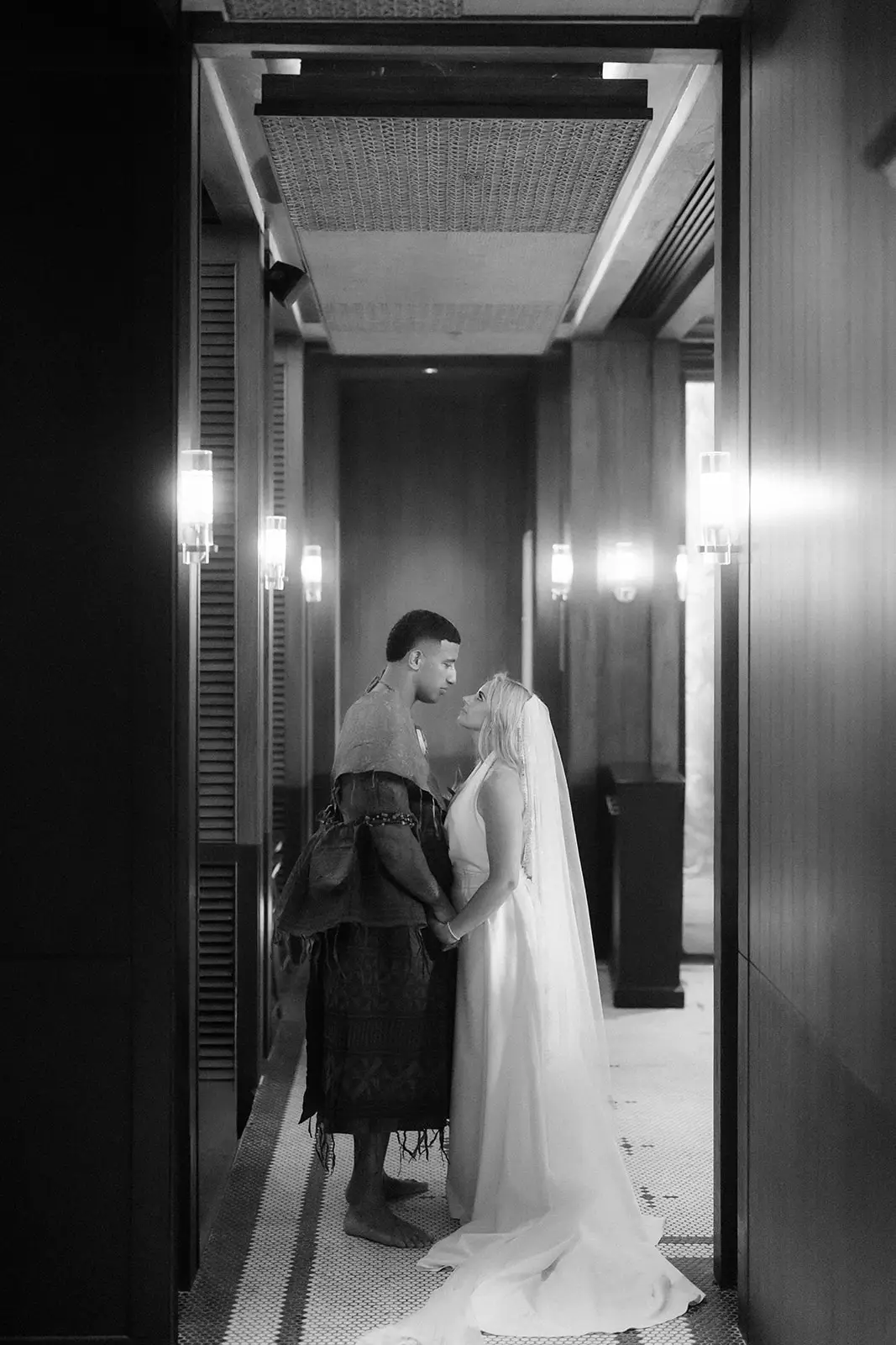 The couple down a resort corridor, Crowne Plaza Nadi Bay