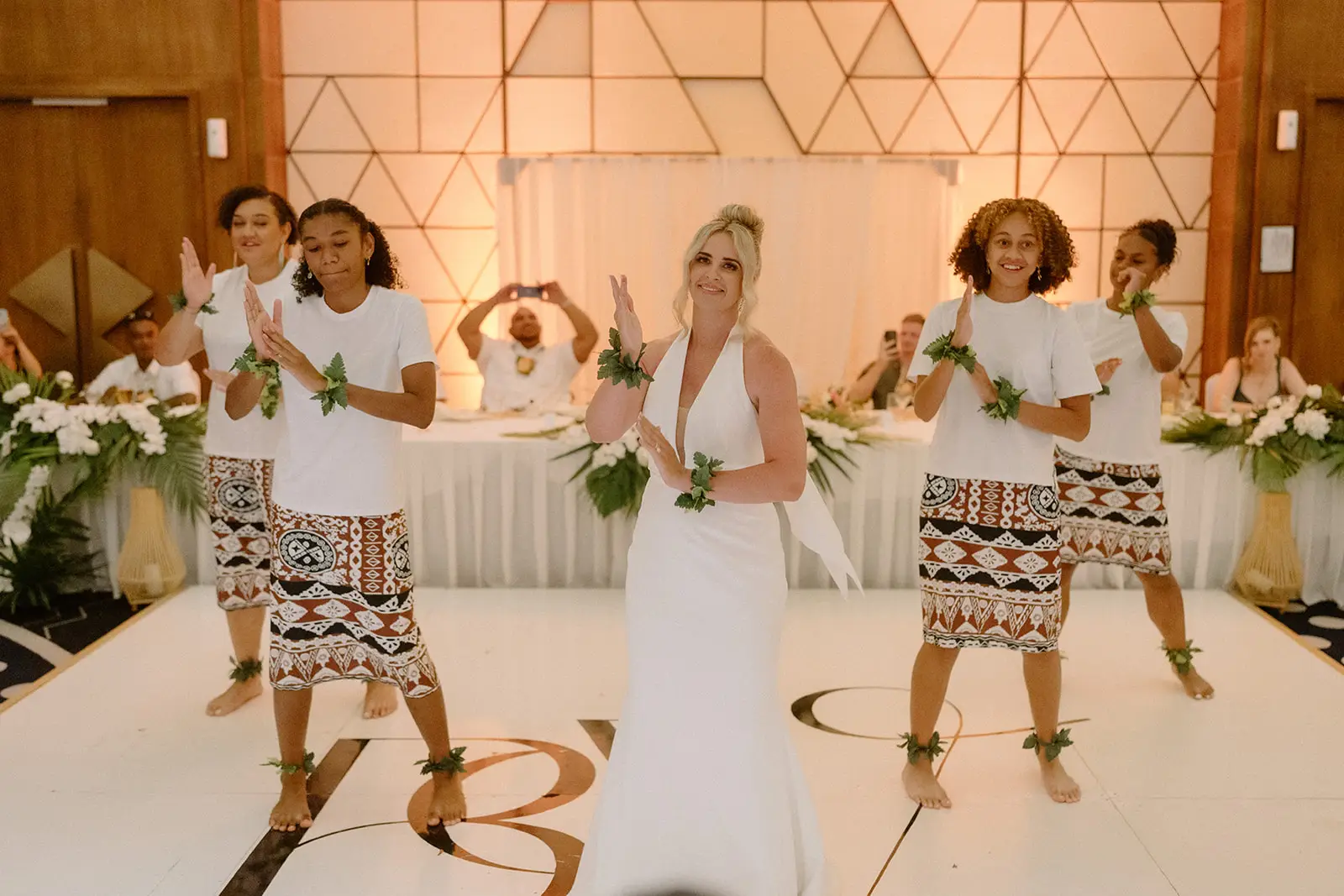 Fijian dancers perform for Brittany and Viliame at the reception