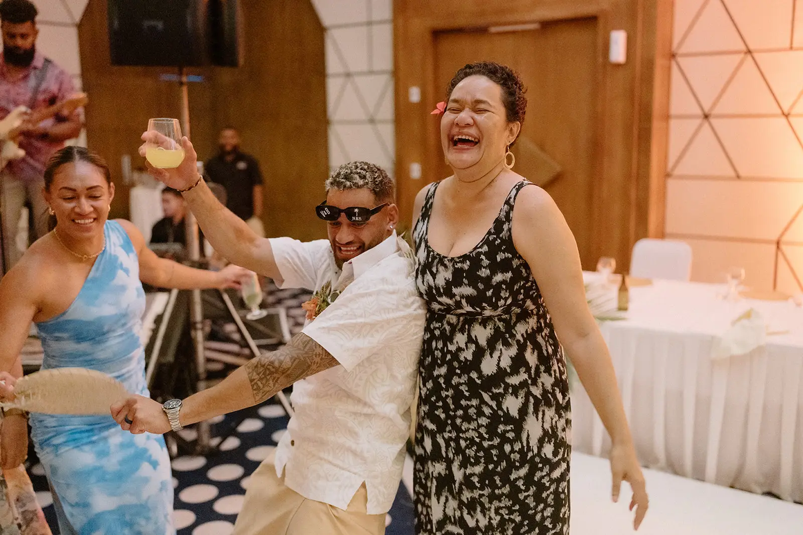 A guest laughing on the dance floor, Nadi Bay