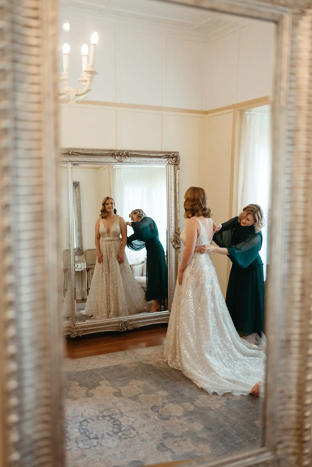 The bride being dressed, reflected in the gilt mirror of the Retreat, Gabbinbar Homestead