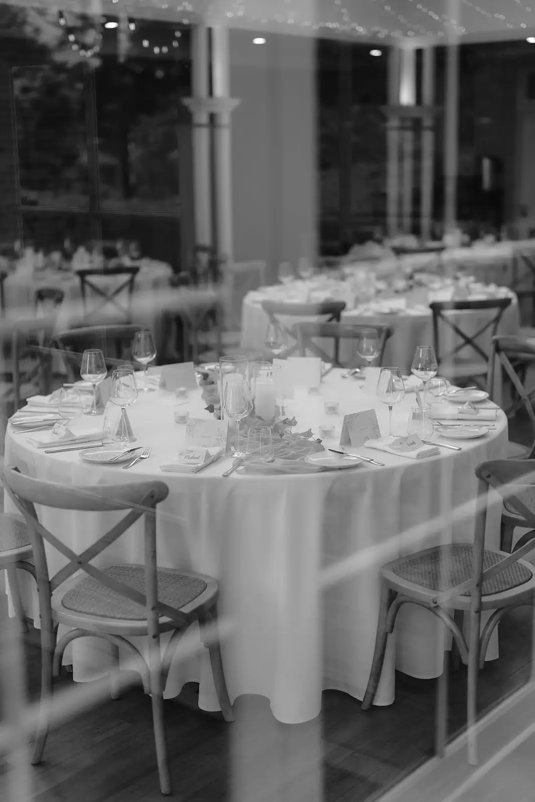 Black and white — round tables set beneath the Conservatory windows, Gabbinbar Homestead