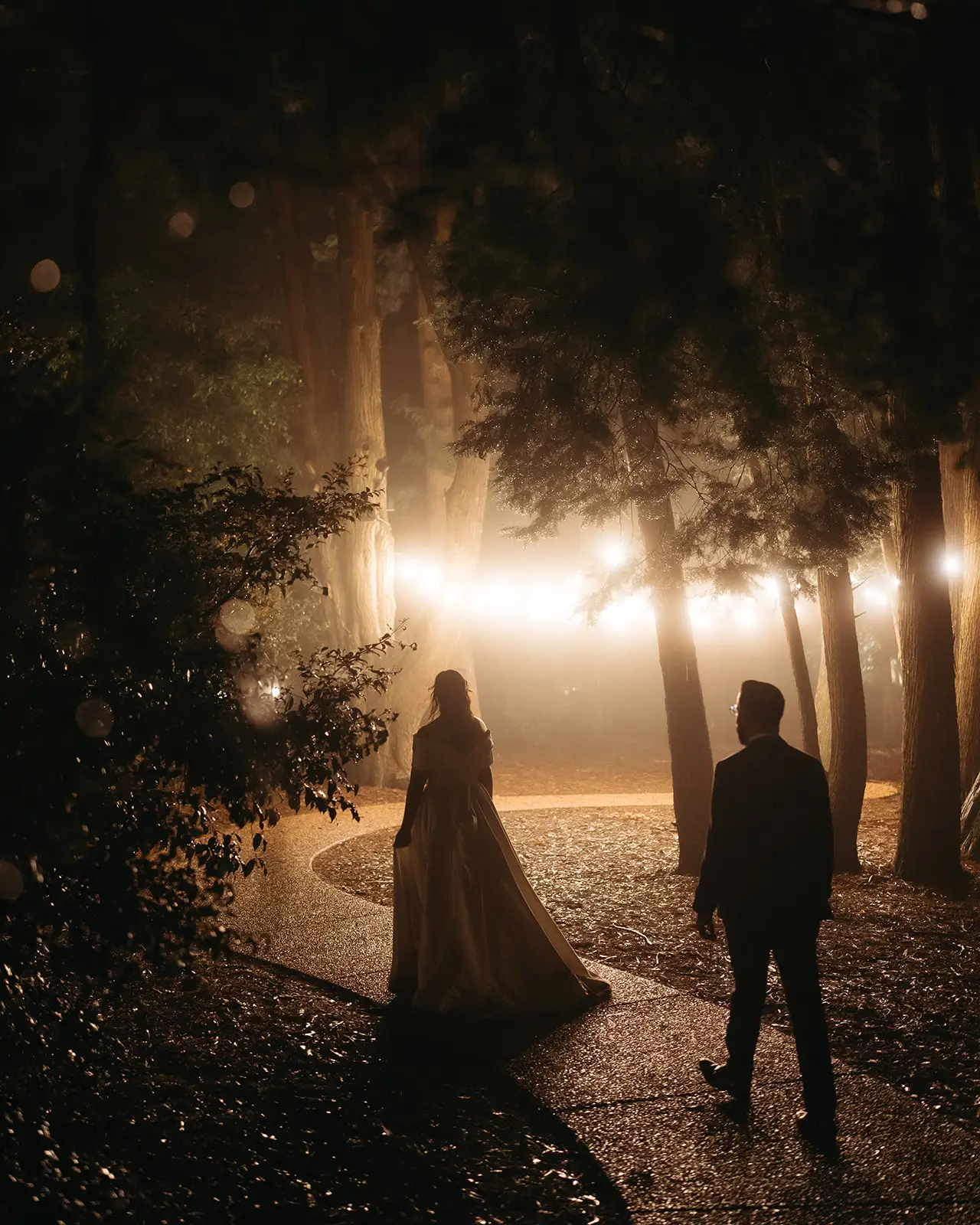 The couple in a backlit avenue of trees, Gabbinbar Homestead