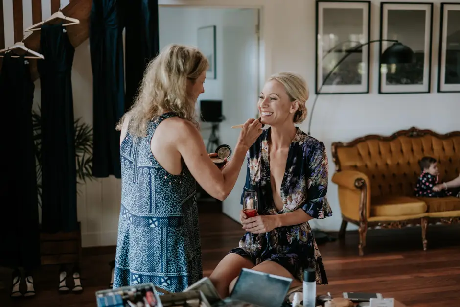 Jessica having her makeup done in the getting-ready house, Goremans Road