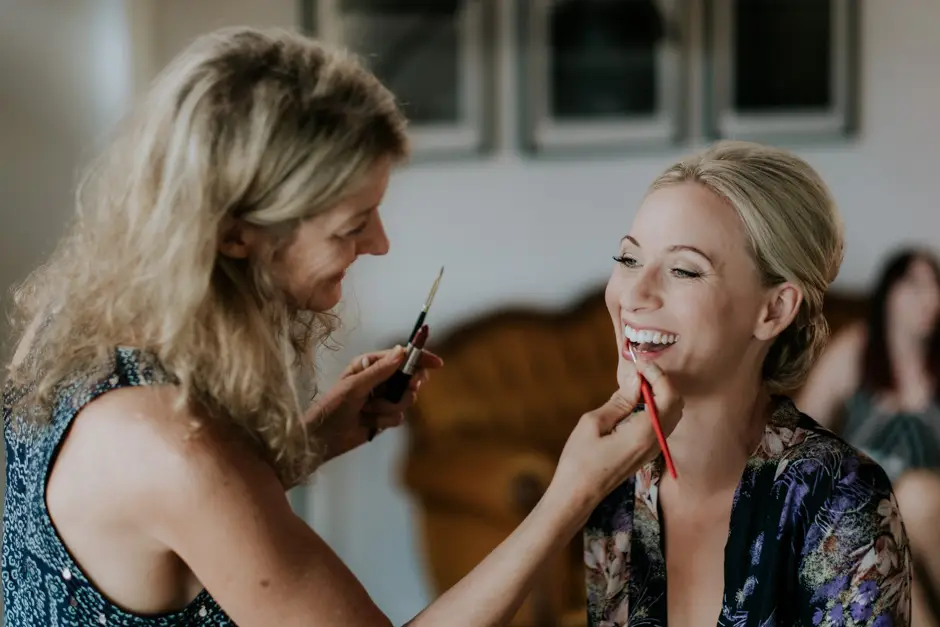 A friend touching up Jessica's lipstick before the ceremony, Eureka