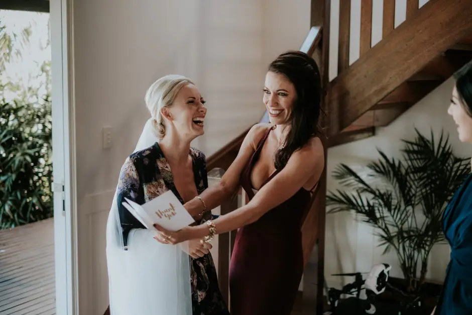 Jessica reading a card from Jarrod with her bridesmaids, Eureka